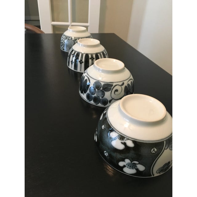 Set of 4 beautiful, vintage Japanese rice bowls. Each bowl has a unique design. Excellent condition.