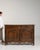 A sideboard whose dark walnut, carved panel doors gives it real character at first glance. It was made in France during...