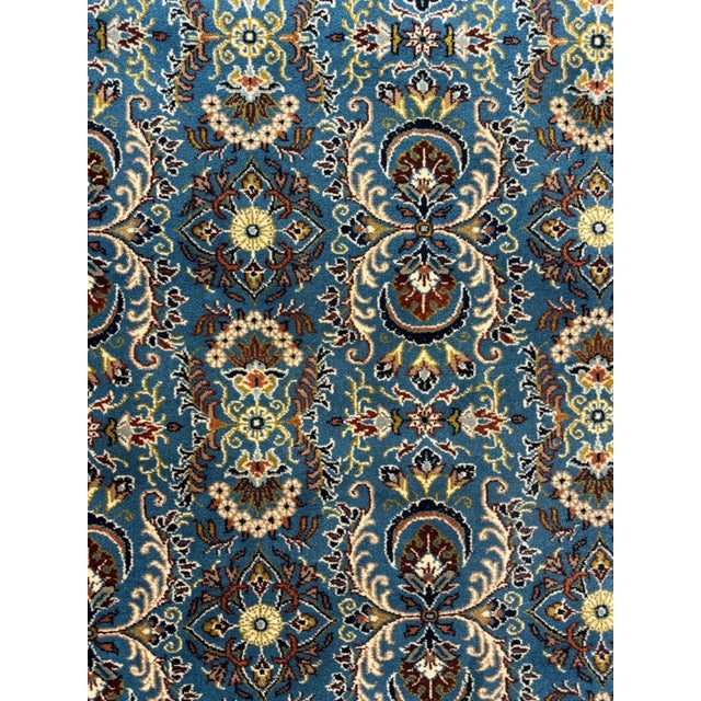 This is an Authentic wool pile genuine hand made signed Persian Qum-