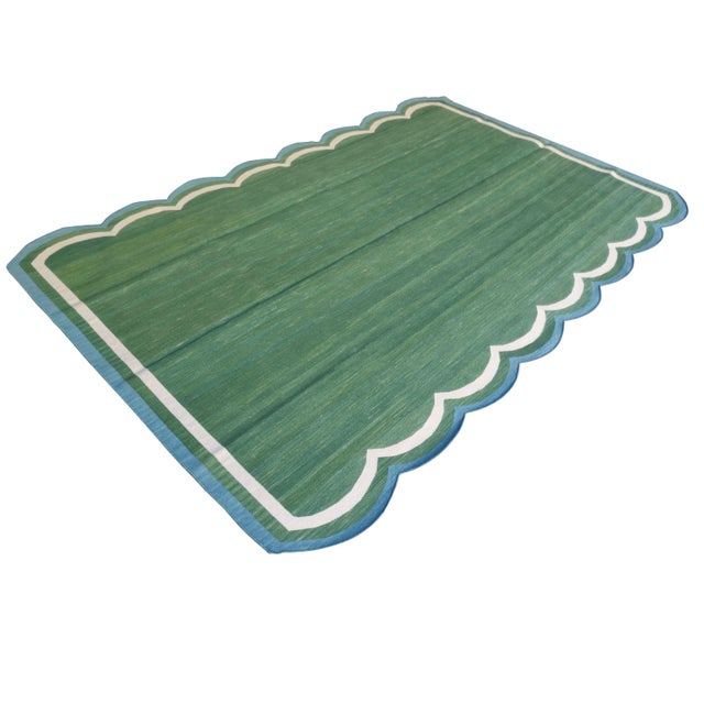 Cotton Scalloped Edge Reversible Rug. Scalloping runs along 8' sides. **Please note - due to the handmade nature of this...