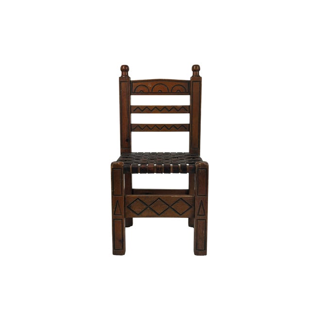 A set of four Spanish chairs produced by Casa Valenti in the 1960s, notable for their solid construction and the beauty of...