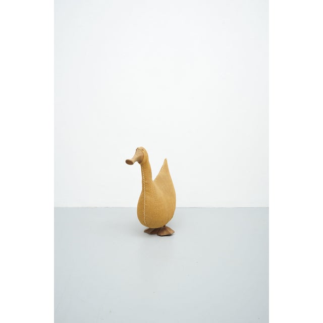 DUCK Duck 1960s - 1970s The duck is made of jute and is hand-sewn in the middle. The duck has a wooden beak and feet. When...