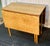 Presenting a masterwork of regional craftsmanship: the Pennsylvania Bench-Made Curly Maple Gate Leg Table. The Allure of...