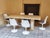 We offer an elegant and timeless dining table made of natural travertine, made around the 1970s. The table will impress...