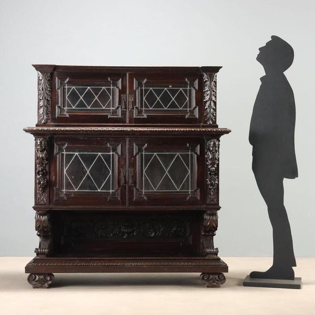 Neo-Renaissance style display cabinet crafted in ebony walnut, dating back to the late 19th century in Italy. The...