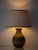 A West German ceramic table lamp in the incised, geometric style of Aldo Londi's Bitossi pottery, here in earthy moss...