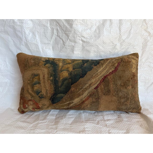This antique pillow is made from an authentic 17th-century Brussels tapestry fragment, preserving a section of the highly...
