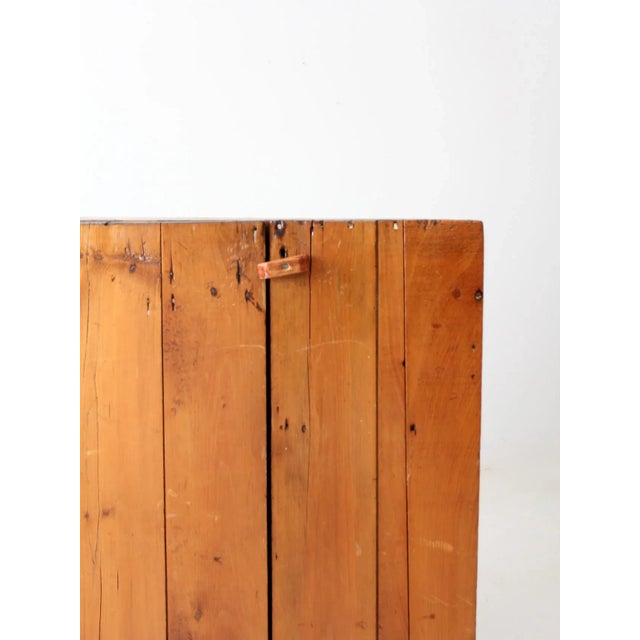This antique primitive cupboard offers timeless rustic charm and practical storage. Crafted with a simple, utilitarian...