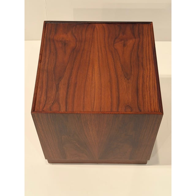 Handsome pair of mid century modern cube shaped walnut end tables having recessed glass fitted tops. Details Dimensions...