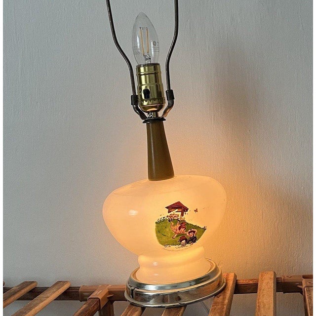 Vintage late 1950s to early 1960s Jack and Jill nursery lamp featuring a charming storybook scene on milk glass. This...