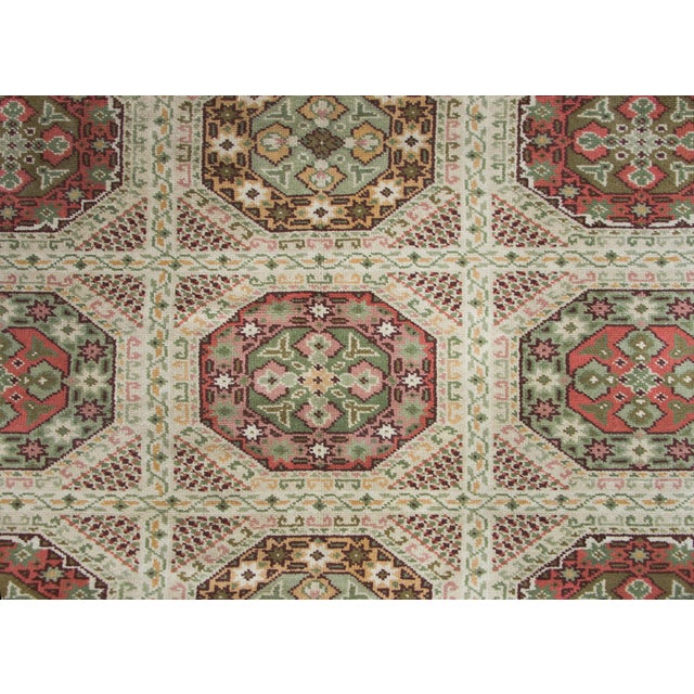 A wonderful early 20th century Austrian hand knotted wool rug with a repeated octagonal medallion and trellis pattern with...