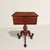 Crafted of glowing 19th century American cherry, this side table rises on a turned pedestal that unfurls into three...