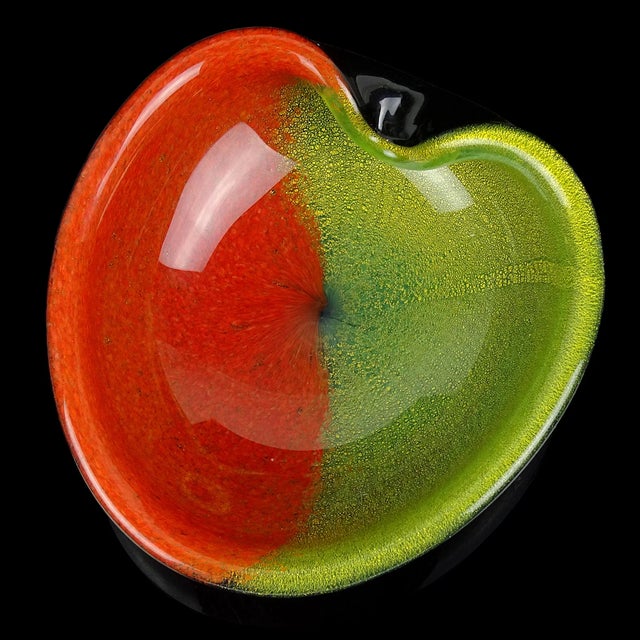 Beautiful vintage Murano hand blown black, red, green and gold flecks Italian art glass heart shape bowl. The piece has a...