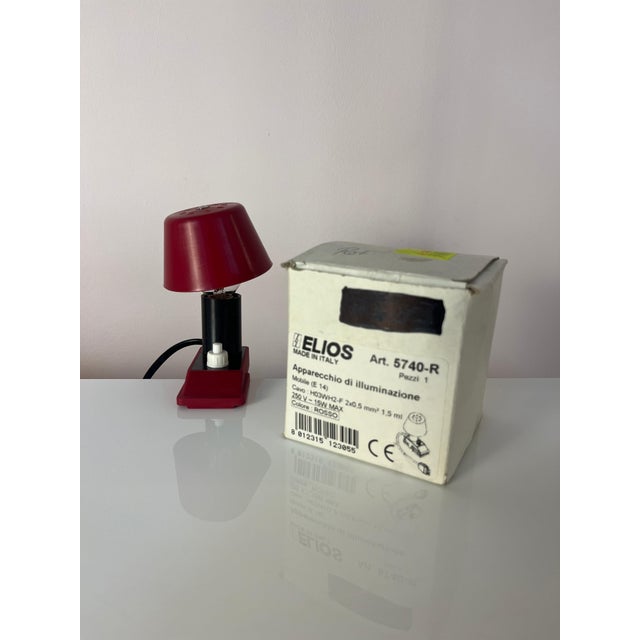 This red clamp lamp from Elios is a collector's item from the Italian design house Elios, bringing the playful charm of...