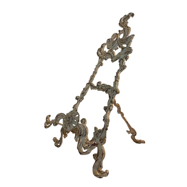 This is a gorgeous French Baroque ornate table top art easel or picture stand. It is cast iron with an ivory distressed...