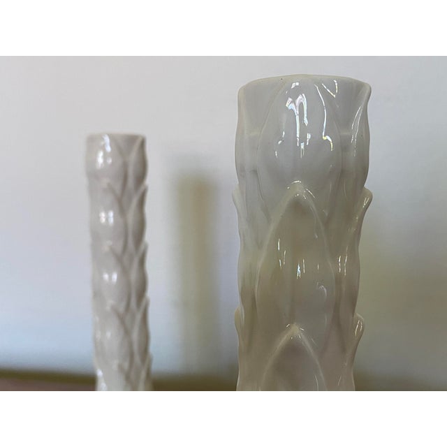 An incredibly chic yet modern pair of white capodimonte pottery candlesticks which where manufactured in Italy by Este...