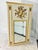 An early 21st century Italian trumeau/wall mirror with gilt carved musical trophy design and trim.