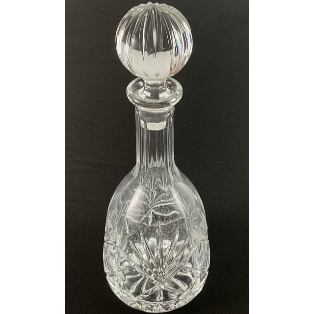 Noble Excellence-cut glass decanter Cut with fans around the base, fluted neck, and cut V groove stopper w