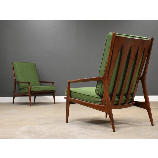 A rare pair of mid century modern walnut tall back “The Archie Chair” lounge chairs designed by Milo Baughman for Thayer...