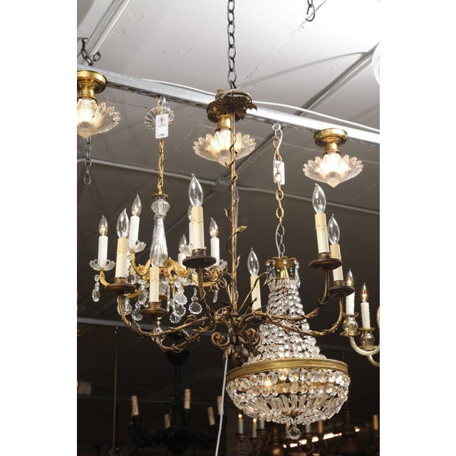 This is a fantastic example if a vintage gilt Italian tole chandelier,. Six gracefully curved arms emerge from a central...