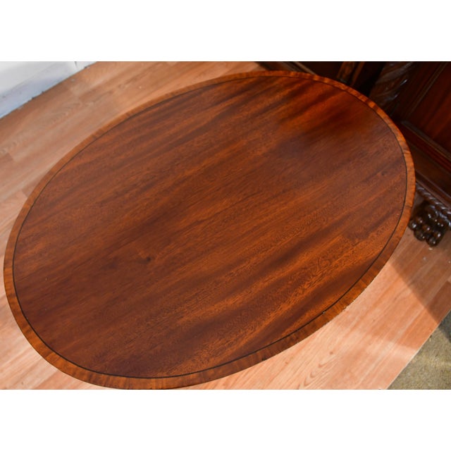 We are Pleased to offer this beautiful pair of English Hepplewhite side tables, from the 1910s. This pair is made of...