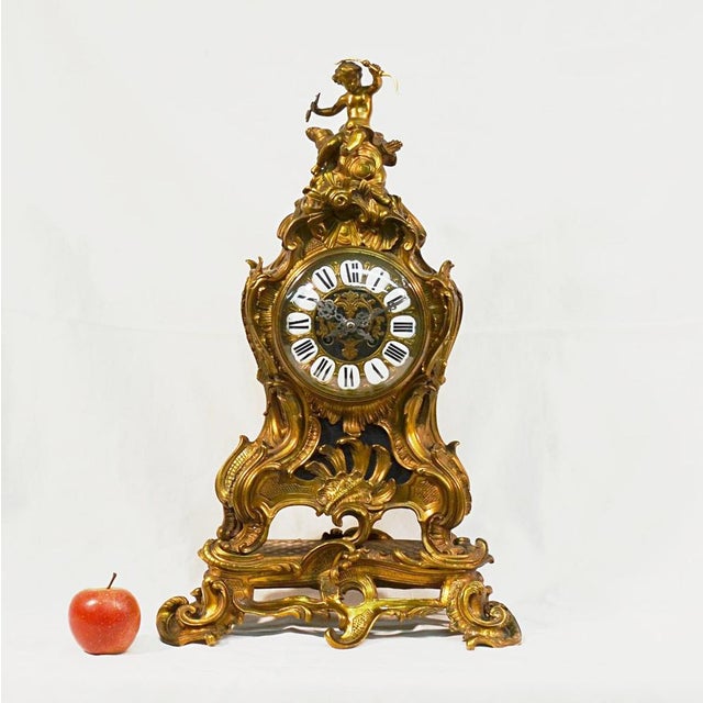 Large ormolu mantel set in the louis xv rocaille style, napoleon iii period, 19th century, consisting of a clock and a...