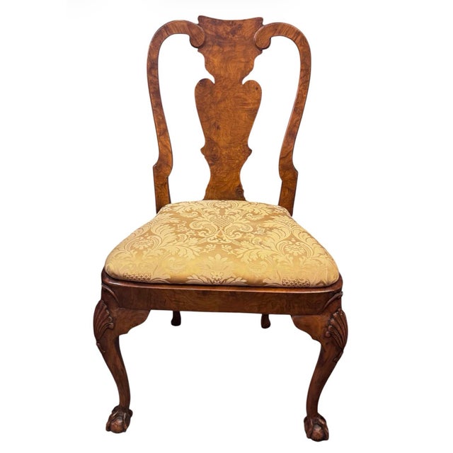 An exceptional and beautifully figured set of ten Queen Anne style dining chairs, including eight side chairs and two...