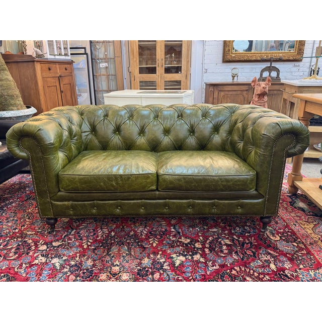 Upholstered in rich Brazilian cowhide leather, this collection stands out with its distinctive Great Britain racing green...