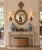 A beautifully proportioned mid-20th century convex wall mirror in the Robert Adam style, featuring a classic giltwood...