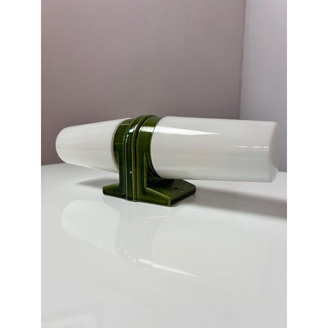 A unique piece in green! The Model 6065 double light by Sigvard Bernadotte for Ifö impresses with its timeless and elegant...