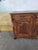 A very fine walnut sideboard, richly carved with vegetal motifs and foliate scrolls. the front features two doors with...
