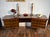 A simple and elegant but stunning walnut and teak desk from the early mid century. This desk has a curved design and made...