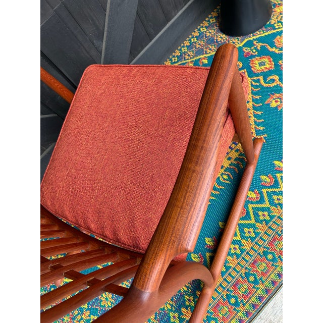 This particular Wegner teak rocker has the most beautiful woodgrain pattern! Professionally refinished including new high...