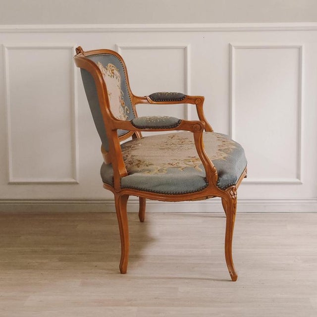 This two-seater upholstered bench was made in France between approximately 1920 and 1949 in the Louis XV style. The curved...