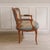 This two-seater upholstered bench was made in France between approximately 1920 and 1949 in the Louis XV style. The curved...