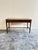Danish Desk from the 1950s Made of teak, the desk features two drawers with recessed handles.