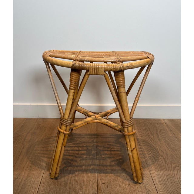 This beautiful designer stool is made entirely of rattan. It is a French piece. Circa 1970
