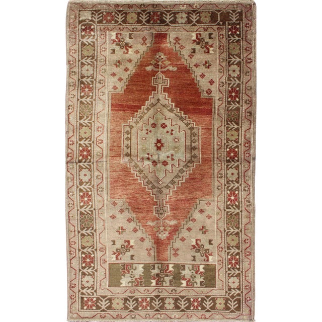 Vintage Oushak Rug With Geometric Motifs in Terracotta, Green and Tan For Sale