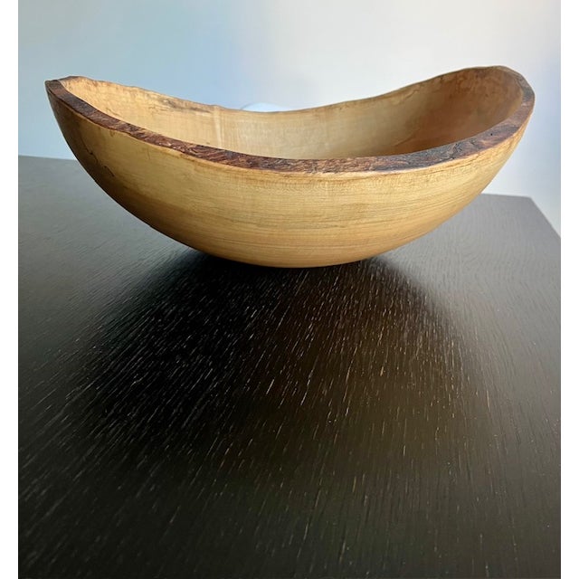 A hand-turned spalted maple bowl by Spencer Peterman, created exclusively for Calvin Klein Home during the brand’s...