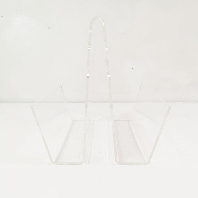 This newspaper rack originated in Italy in the 1970s. It features a spacious, minimalist, modern design. Made of acrylic...
