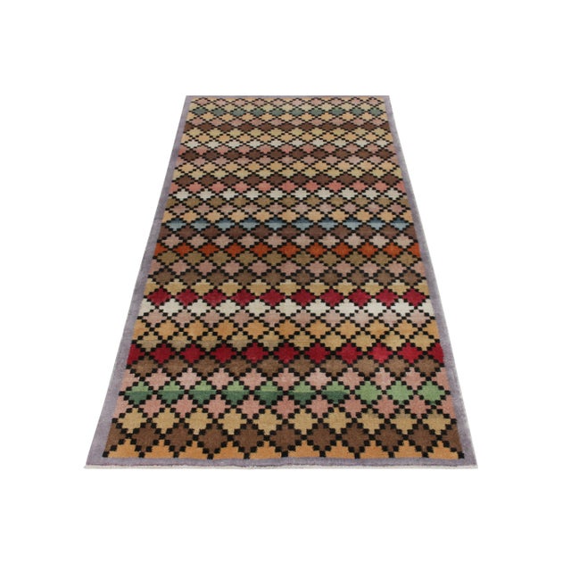 Hand-knotted in wool circa 1960-1970, a 4X8 vintage rug from an Bold Turkish designer commemorated in Rug & Kilim’s Mid-...