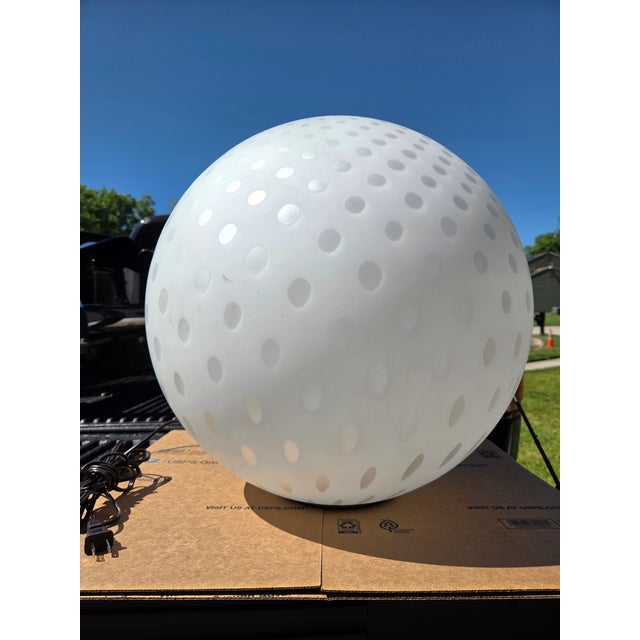 this lamp can be used as a table lamp of floor lamp. it sits on the round metal base that is almost invisible when in...