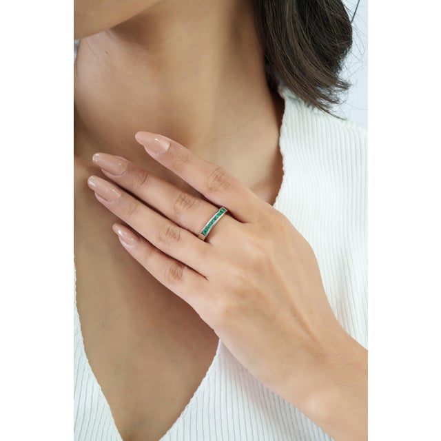 Add a refined touch of color to your jewelry collection with this elegant half eternity band ring, featuring 0.85 carats...