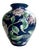 Vintage Chinese porcelain vase, decorated with peonies and other flowers in a pink and white motif against a deep cobalt...