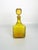Decorative French glass bottle dating from the 1970s, featuring a striking yellow-amber color and its original matching...