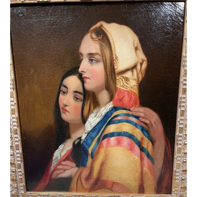 A stunning 19th century orientalist oil portrait painting of two beautiful young women in colorful garments. It is signed...