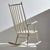 Sculpture-like rocking chair with high backrest from the 1960s. with some paint wear and scratches in vintage condition.