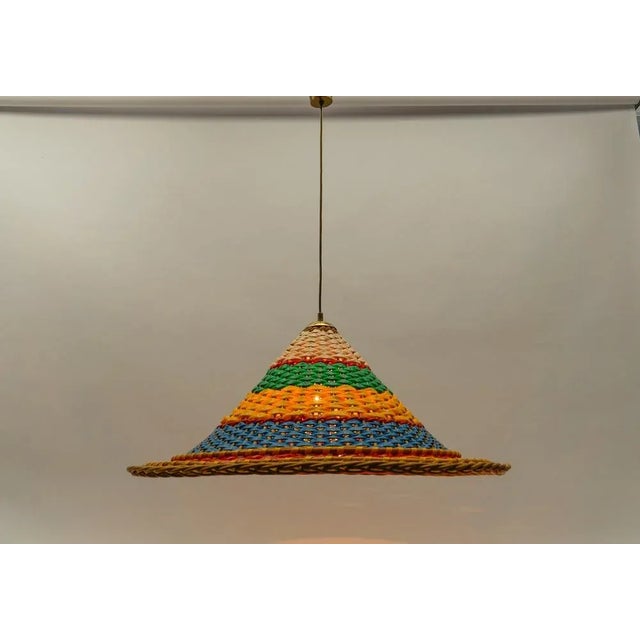 Executed in brass rattan and pvc. The lamp need 1x e27 / e26 edison screw fit bulb, is wired, in working condition and...