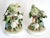 Offering a pair of hand painted porcelain parakeet figurine sculptures, circa 1960s. These ceramic figurines depict two...