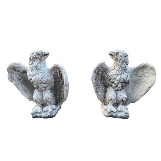 Add a commanding sense of classic architectural elegance to your estate with this striking pair of vintage cast stone...